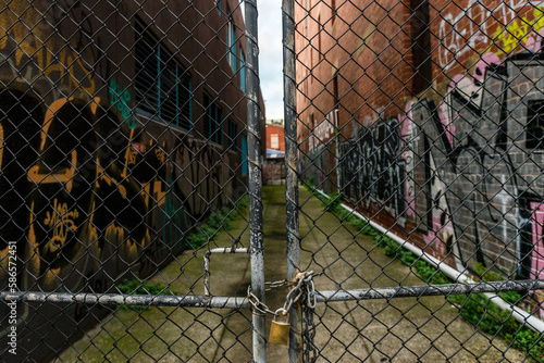 iconic grungy laneways of Melbourne city, with random graffiti photo