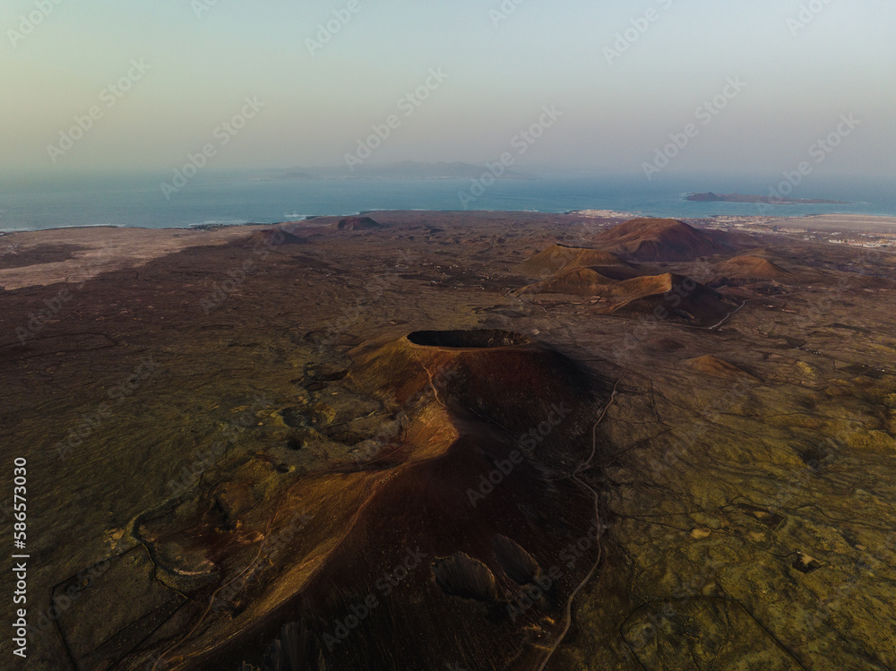 View from above, stunning aerial view of Calderon Hondo during a beautiful sunrise. Calderon Hondo is a volcanic caldera in the sland of Fuerteventura, Canary Islands.