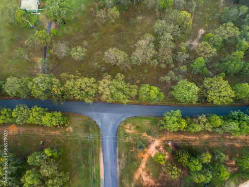 T intersection of rural roads seen from overhead photo
