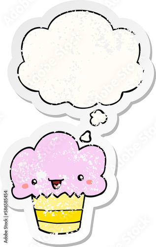 cartoon cupcake with face and thought bubble as a distressed worn sticker