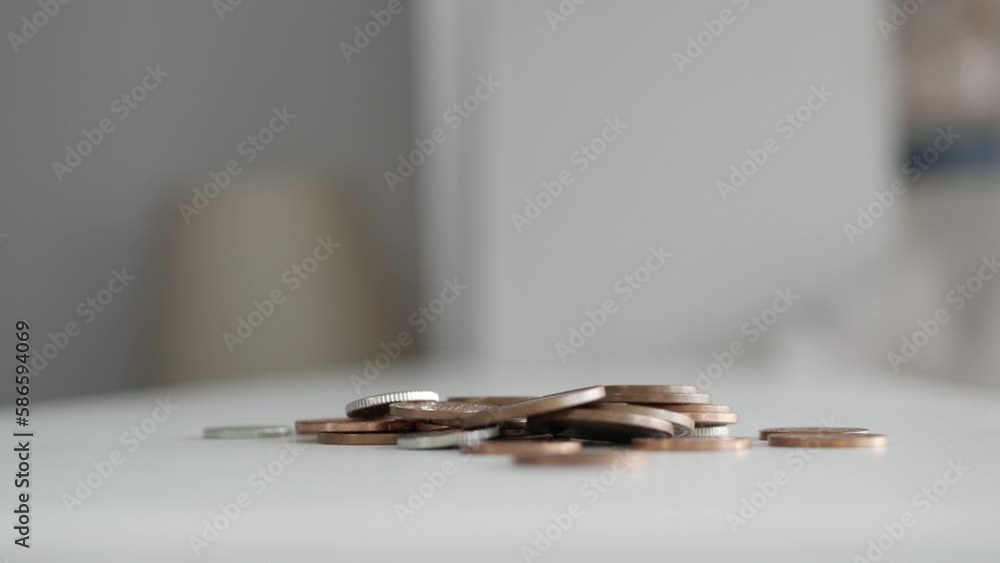 Blurred Shooting with a Man Making a Payment with Metallic Coins. Financial Concept with a Man Paying with Coins in a Market. Blurred Shooting with a Man Making a Payment with Metallic Coins. Financial Concept with a Man Paying with Coins in a Market.