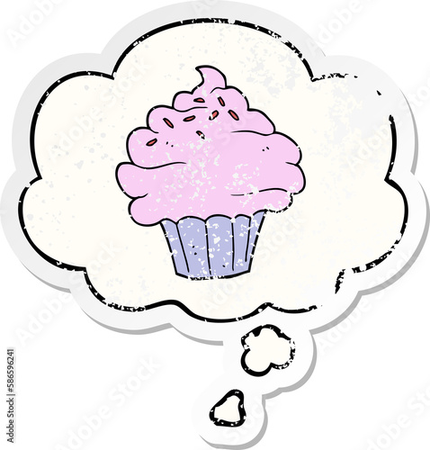 cartoon cupcake and thought bubble as a distressed worn sticker