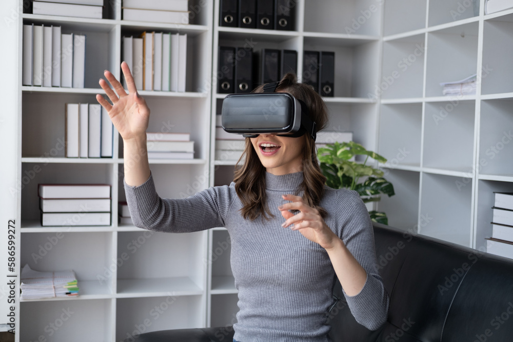 Beautiful woman in virtual reality glasses having fun at home. Beautiful woman in virtual reality glasses having fun at home.
