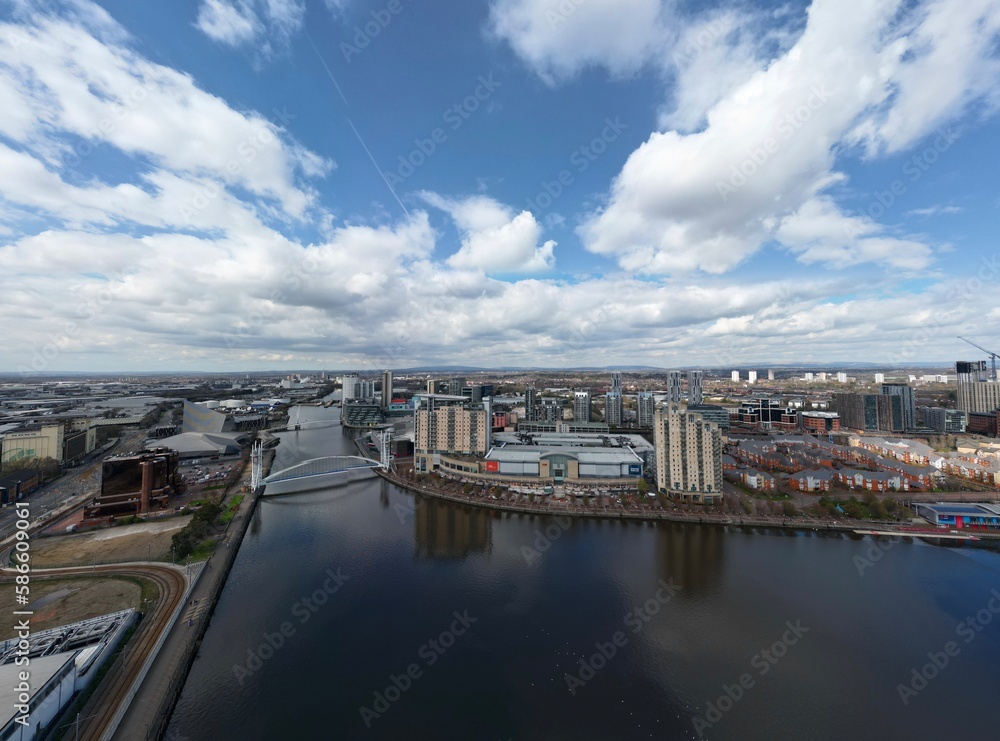 Aerial view of Salford Quays with river views and modern buildings. 