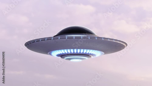 Rotating Flying Saucer UFO in the sky. Silhouette for Stencil Luma alpha matte blending included. Footage of UFO on green color key background included. Loop video in 4K Ultra HD. photo