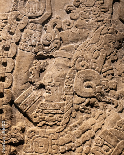 Photography Maya bas relief carving stela 31 of mayan city state king of Tikal in Guatemala, Mexico City, Mexico