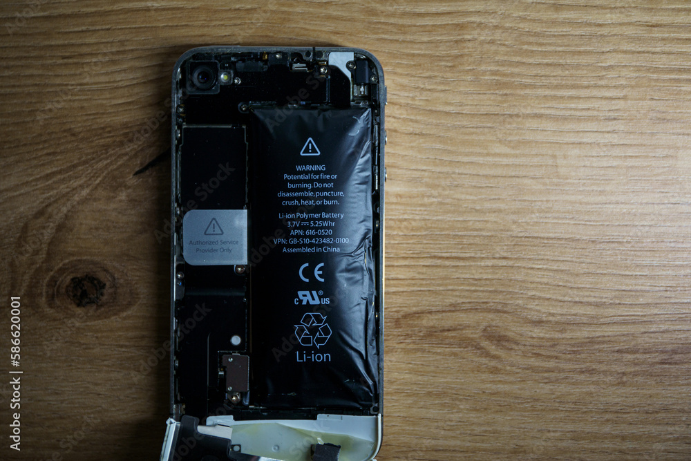 Iphone with exploded Lithiumion battery. Liion swollen battery Stock