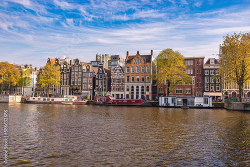 Amsterdam Netherlands, city skyline at canal waterfront © Noppasinw