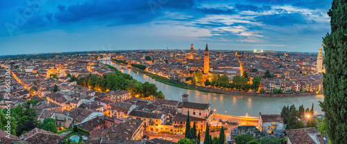 Verona Italy, high angle view panorama night city skyline at Adige river