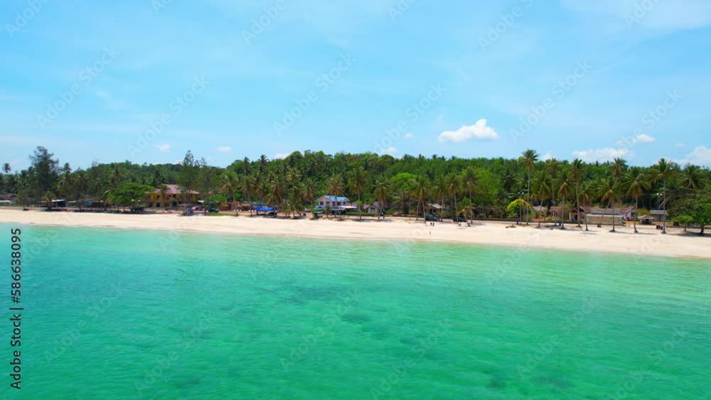As the drone glides over the crystal-clear waters of the Thai coast, the view is filled with swaying coconut trees lining the sandy shoreline, providing a stunning contrast to the deep blue sea below
As the drone glides over the crystal-clear waters of the Thai coast, the view is filled with swaying coconut trees lining the sandy shoreline, providing a stunning contrast to the deep blue sea below