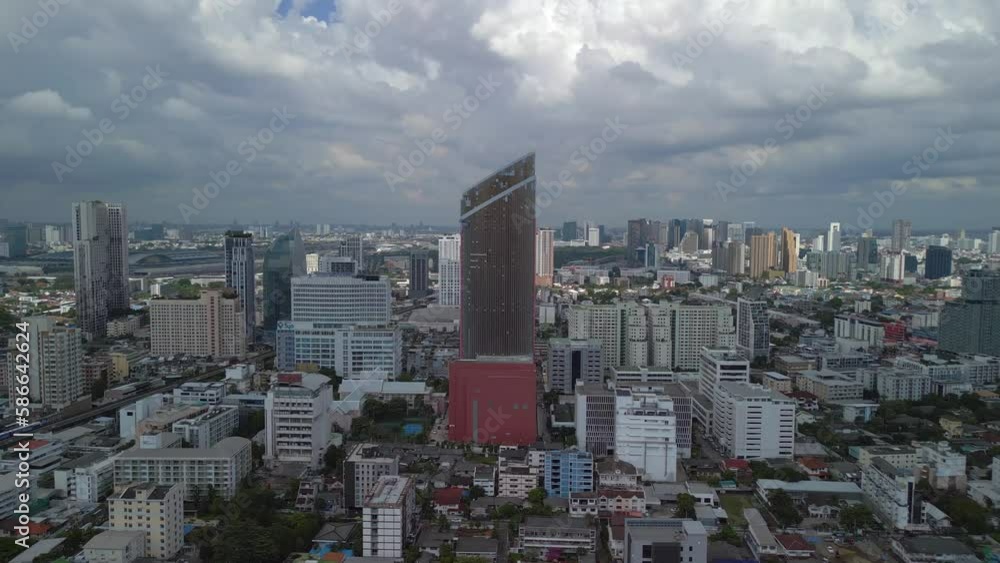 mighty skyscraper in the Asian metropolis. Dramatic aerial view flight drone mighty skyscraper in the Asian metropolis. Dramatic aerial view flight drone