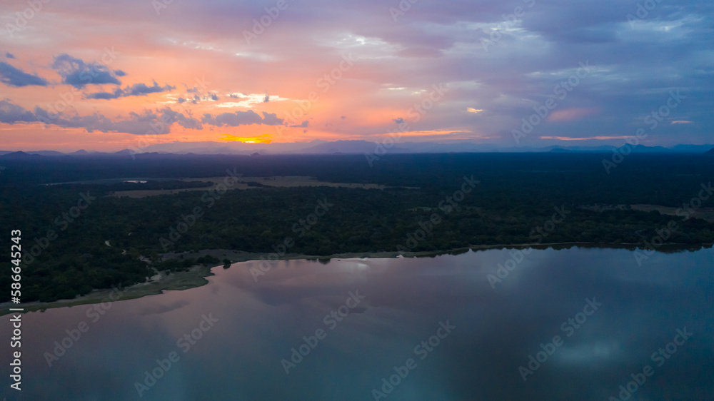 Sunset in Sri Lanka National Park. Panama Wewa lake, Arugam bay.
