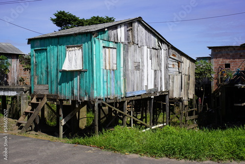 Wooden houses built on high stilts called in Portuguese palafitas. Cacao Pirêra, Amazonas - Brazil   © guentermanaus