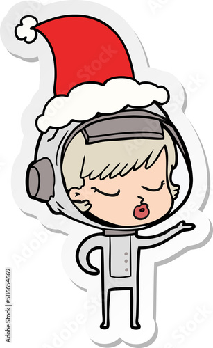 sticker cartoon of a pretty astronaut girl wearing santa hat