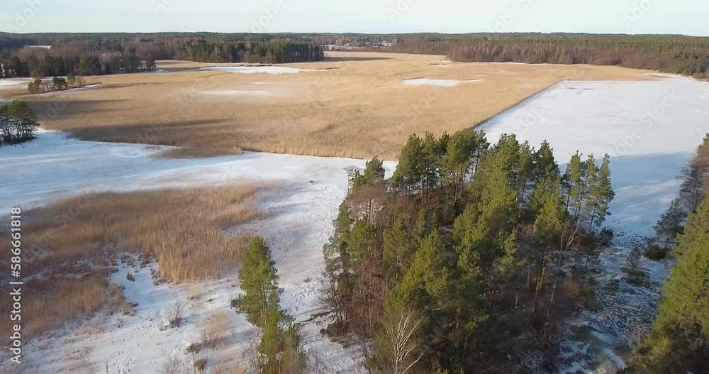 Aerial view of sunny winter landscape with snow on the ground, Kopparnäs, Finland.