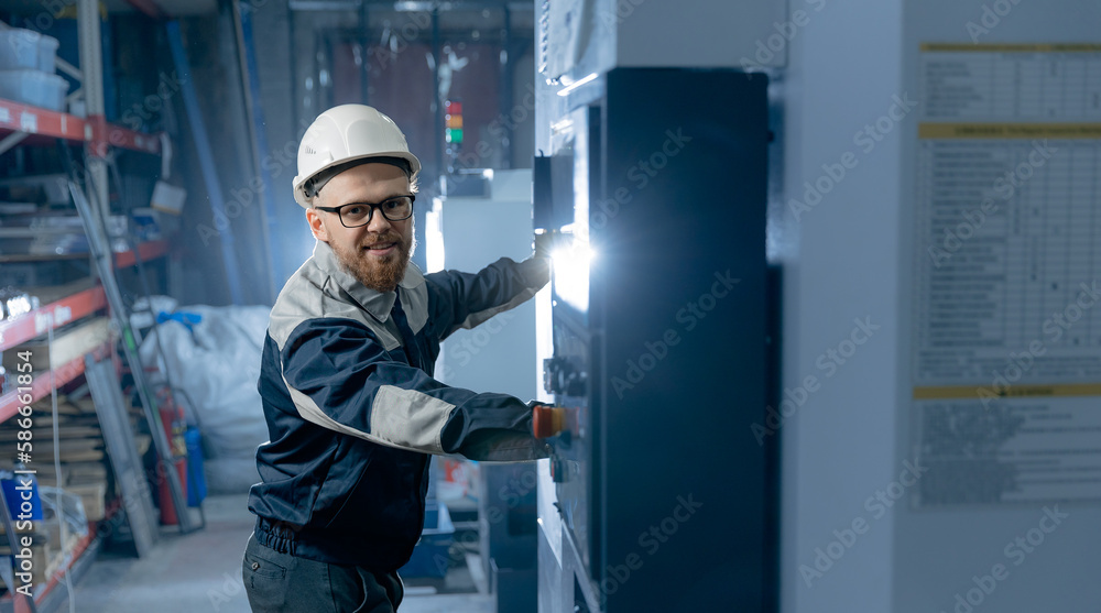 Engineer Worker caucasian man professional control CNC machinery on industry factory Engineer Worker caucasian man professional control CNC machinery on industry factory