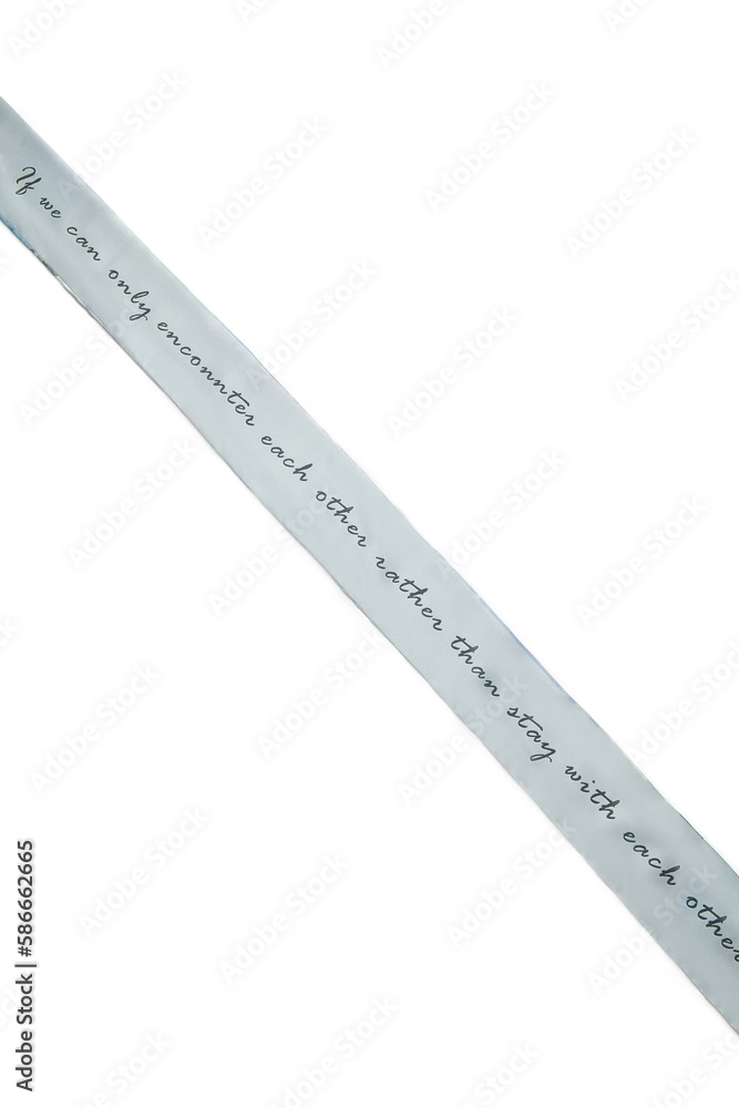 Close-up shot of a twilly ribbon for hair. Women's silk hair band with letter pattern is isolated on a white background. Front view. Close-up shot of a twilly ribbon for hair. Women's silk hair band with letter pattern is isolated on a white background. Front view.