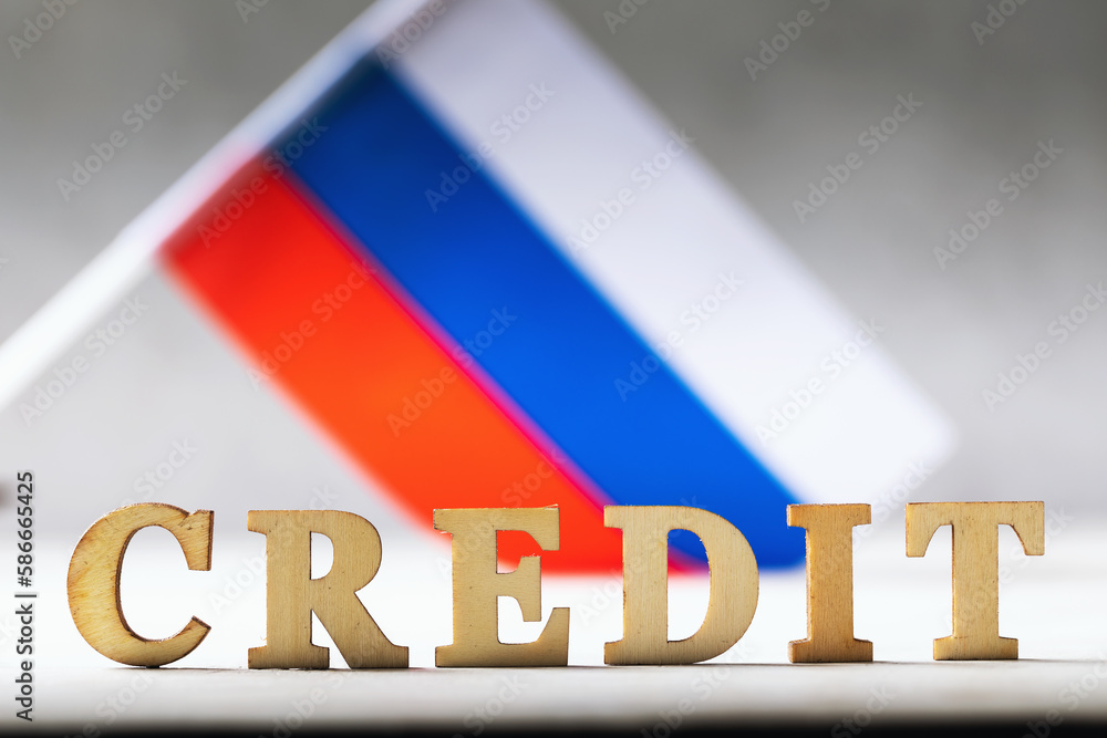 Text from wooden letters and the Russian flag on an abstract background ...