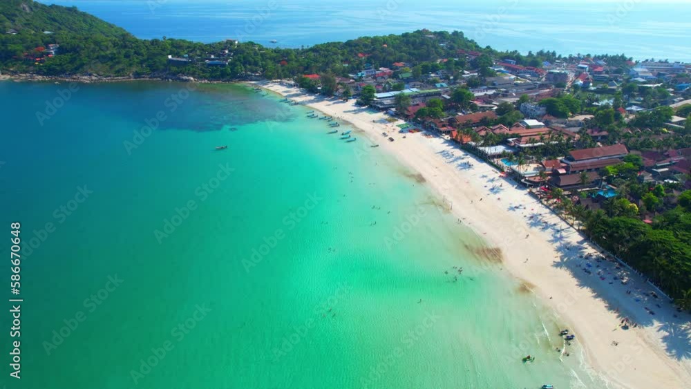 When viewed from an aerial drone, Haad Rin offers a stunning sight of crystal-clear waters and pristine white sand that stretches for almost a kilometer (Haad Rin, Koh Phangan, Thailand). 4K HDR
When viewed from an aerial drone, Haad Rin offers a stunning sight of crystal-clear waters and pristine white sand that stretches for almost a kilometer (Haad Rin, Koh Phangan, Thailand). 4K HDR