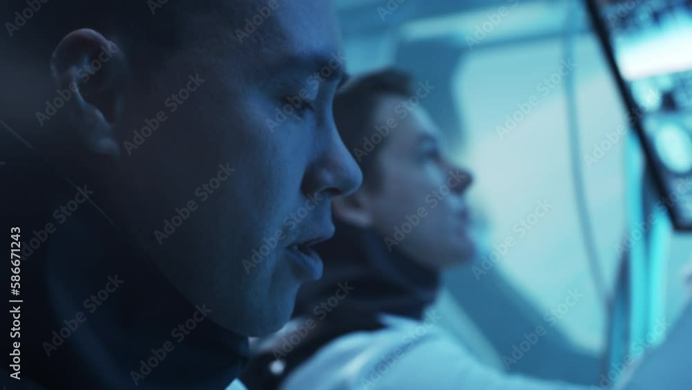 Team of astronauts in a space suits aboard the orbital station. A crew of cosmonauts piloting the spaceship in space. Galactic travel and science. Team of astronauts in a space suits aboard the orbital station. A crew of cosmonauts piloting the spaceship in space. Galactic travel and science.