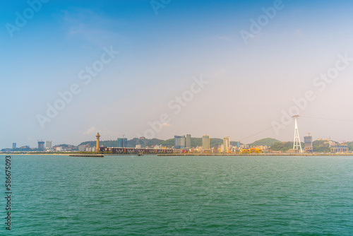 View of Ha Long City, Quang Ninh province, Vietnam with development ferris wheel, cable car, Bai Chay bridge, near Ha Long bay.