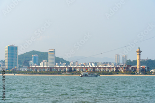 View of Ha Long City, Quang Ninh province, Vietnam with development ferris wheel, cable car, Bai Chay bridge, near Ha Long bay.