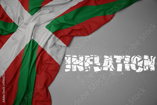 waving colorful national flag of basque country on a gray background with broken text inflation. 3d illustration