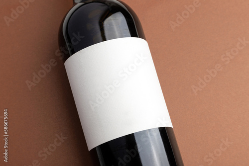 a bottle of red wine with a blank label