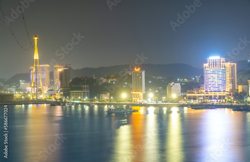 Colorful night view of Bai Chay Bridge, connecting two parts of Ha Long City, Hon Gai City and Bai Chay City through Cua Luc Bay. © CravenA