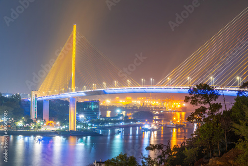 Colorful night view of Bai Chay Bridge, connecting two parts of Ha Long City, Hon Gai City and Bai Chay City through Cua Luc Bay.