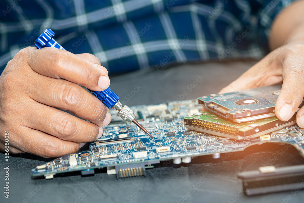 Repairing and upgrade circuit mainboard of notebook, electronic, computer hardware and technology concept. Repairing and upgrade circuit mainboard of notebook, electronic, computer hardware and technology concept.
