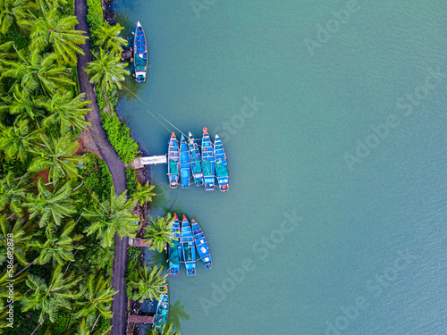 Fishing boats in the Kerela backwaters, India photo
