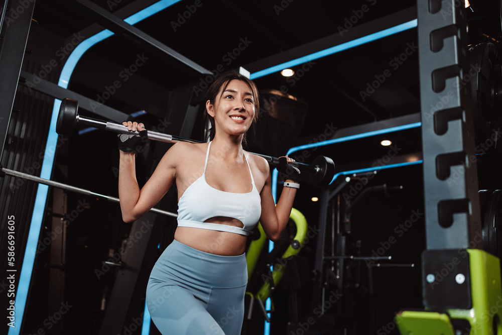 Woman working out Bodybuilder with barbell weights at the gym. bodybuilder doing exercises with barbell. training sport healthy lifestyle bodybuilding, Athlete builder muscles lifestyle. Woman working out Bodybuilder with barbell weights at the gym. bodybuilder doing exercises with barbell. training sport healthy lifestyle bodybuilding, Athlete builder muscles lifestyle.