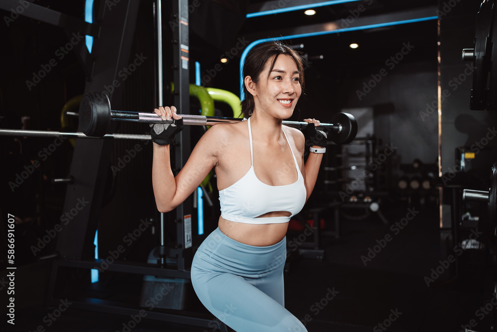 Woman working out Bodybuilder with barbell weights at the gym. bodybuilder doing exercises with barbell. training sport healthy lifestyle bodybuilding, Athlete builder muscles lifestyle. Woman working out Bodybuilder with barbell weights at the gym. bodybuilder doing exercises with barbell. training sport healthy lifestyle bodybuilding, Athlete builder muscles lifestyle.