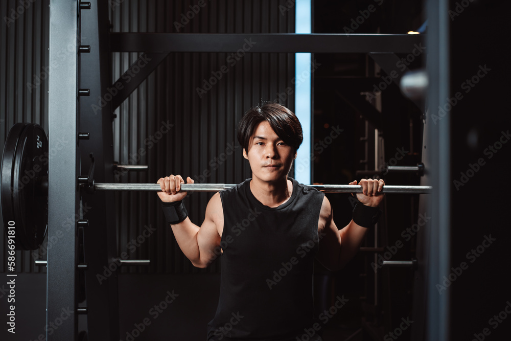 Man working out Bodybuilder with barbell weights at the gym. bodybuilder doing exercises with barbell. training sport healthy lifestyle bodybuilding, Athlete builder muscles lifestyle. Man working out Bodybuilder with barbell weights at the gym. bodybuilder doing exercises with barbell. training sport healthy lifestyle bodybuilding, Athlete builder muscles lifestyle.