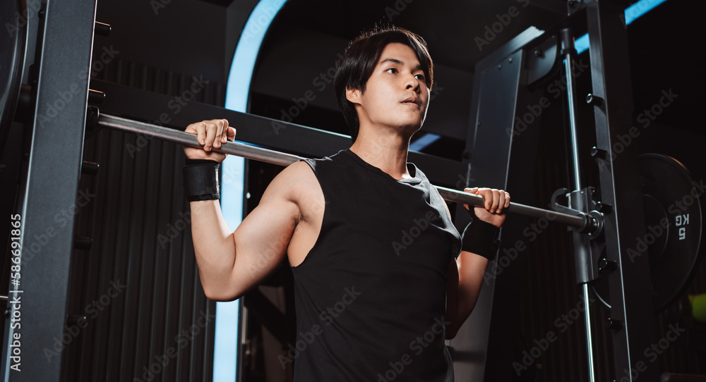 Man working out Bodybuilder with barbell weights at the gym. bodybuilder doing exercises with barbell. training sport healthy lifestyle bodybuilding, Athlete builder muscles lifestyle. Man working out Bodybuilder with barbell weights at the gym. bodybuilder doing exercises with barbell. training sport healthy lifestyle bodybuilding, Athlete builder muscles lifestyle.