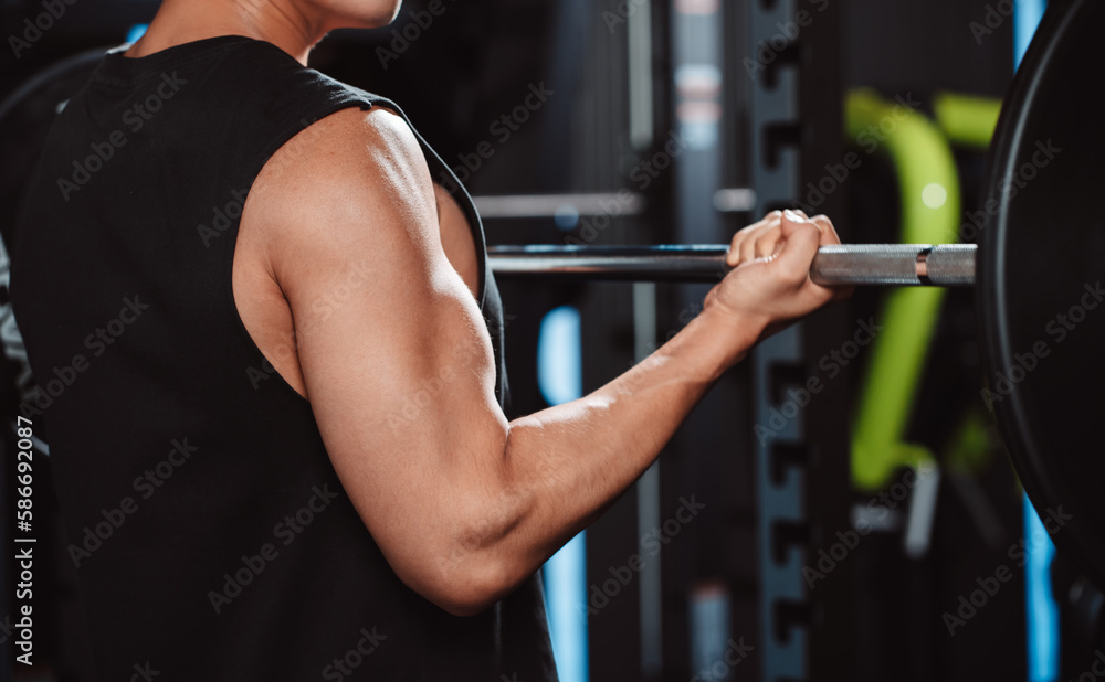 Male working out Bodybuilder with barbell weights at the gym.man bodybuilder doing exercises with barbell. training sport healthy lifestyle bodybuilding, Athlete builder muscles lifestyle... Male working out Bodybuilder with barbell weights at the gym.man bodybuilder doing exercises with barbell. training sport healthy lifestyle bodybuilding, Athlete builder muscles lifestyle...