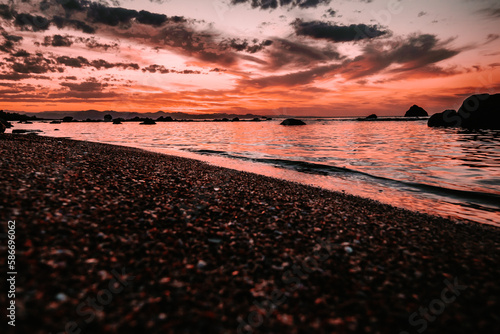 sun burning over the water, horizontal scenery 
