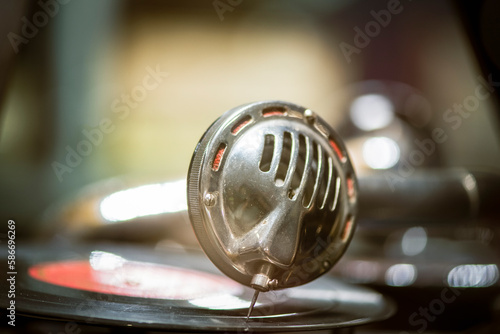 An old gramophone with vinyl records on a  table in a retro style. Vintage. closeup