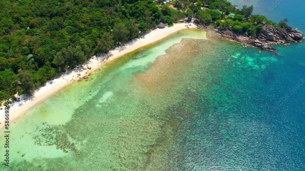 As seen from an aerial view drone, appears as a crescent-shaped stretch of fine white sand that gently slopes down to meet the turquoise waters of the Gulf of Thailand. Tropical and travel concept
As seen from an aerial view drone, appears as a crescent-shaped stretch of fine white sand that gently slopes down to meet the turquoise waters of the Gulf of Thailand. Tropical and travel concept