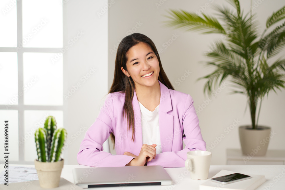 portrait of asian business woman leaning on the table looking at the camera in the office portrait of asian business woman leaning on the table looking at the camera in the office