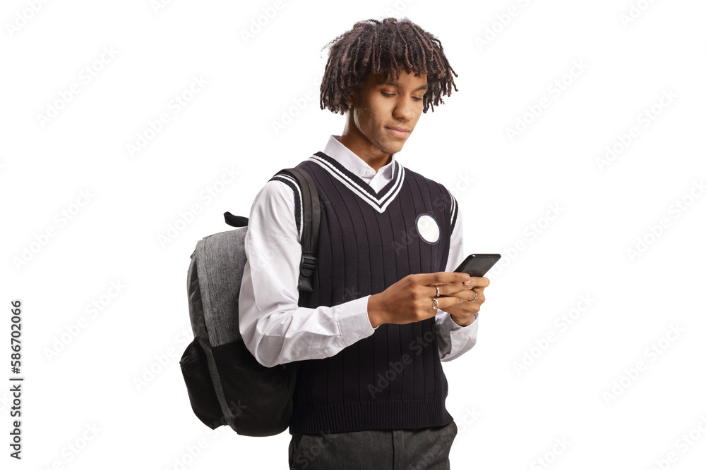 African american male student in a uniform using a smartphone African american male student in a uniform using a smartphone
