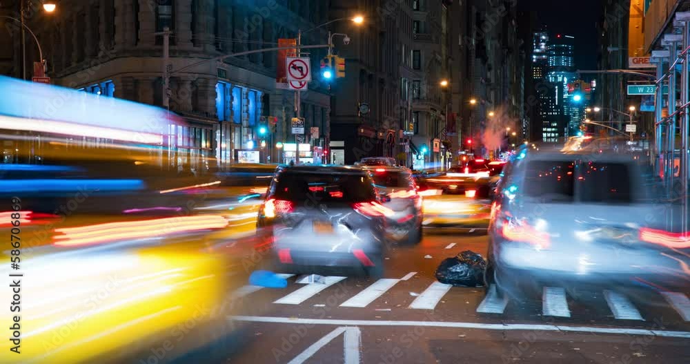 Lockdown Time Lapse Shot Of Cars Moving On Illuminated Street In City At Night - New York City, New York Lockdown Time Lapse Shot Of Cars Moving On Illuminated Street In City At Night - New York City, New York