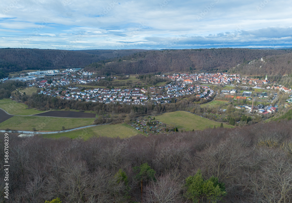 Naklejka premium Drone recording of the city of Blaubeuren in winter when the sun is shining.