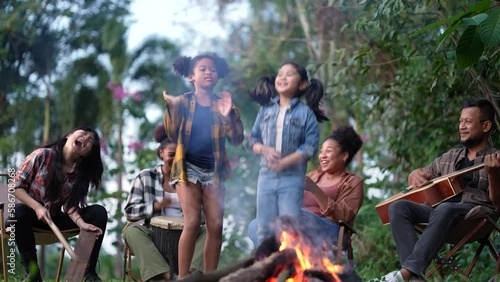 Group of happy friends spending time together traveling and camping.
