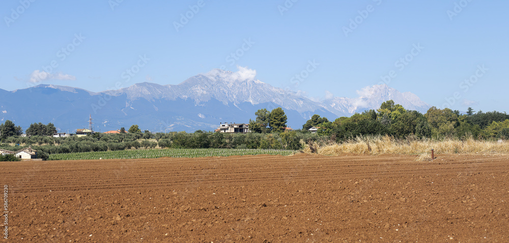 View over fields to the mountains in Abruzzo in Italy in summer