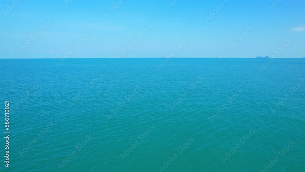 The view of the turquoise sea and blue sky from an aerial view drone is a sight to behold. It is a reminder of the natural beauty that surrounds us and the vastness of the world we live in. 4K
The view of the turquoise sea and blue sky from an aerial view drone is a sight to behold. It is a reminder of the natural beauty that surrounds us and the vastness of the world we live in. 4K