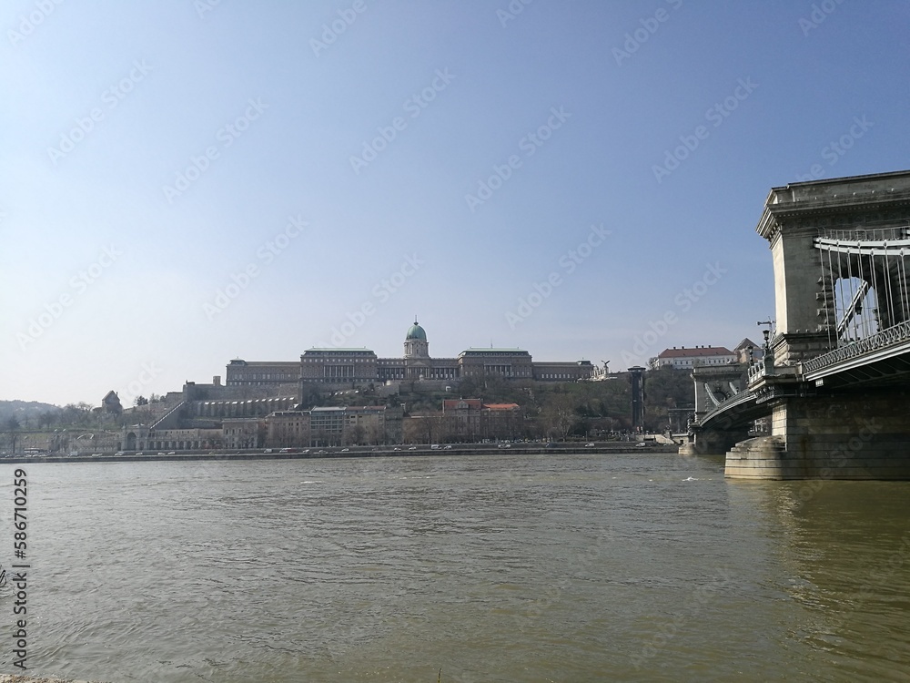 Fototapeta premium Budapest, Hungary: the Széchenyi Chain Bridge in Budapest, with Buda Castle in the background. View from the Danube riverside. 