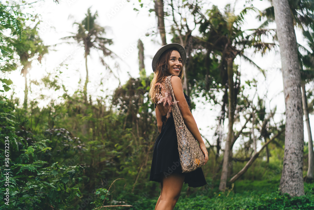 Happy woman in summer outfit walking in park Happy woman in summer outfit walking in park