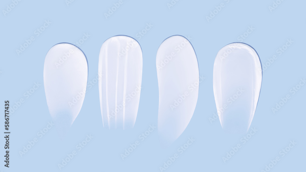Set of smears of cream texture on blue background Set of smears of cream texture on blue background